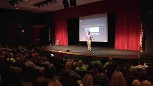 Speaker Scott Crabtree presenting to a large audience